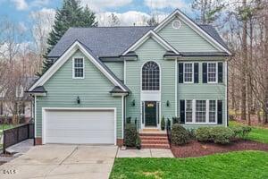 2013 Kinleys Way Raleigh, NC 27613 - Photo 2 of 68 a front view of a house with a garden