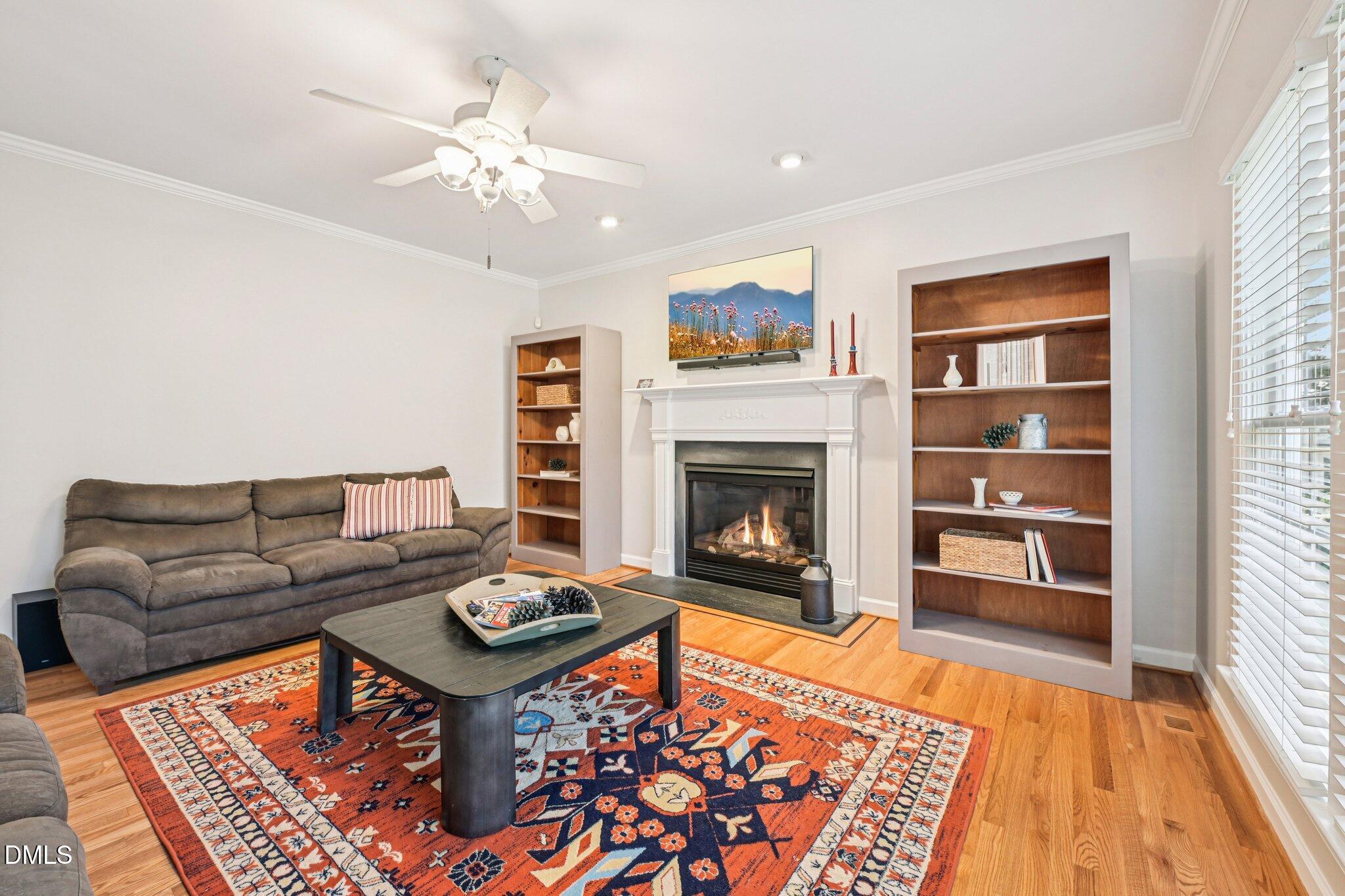 2013 Kinleys Way Raleigh, NC 27613 - Photo 22 of 68 a living room with furniture and a fireplace