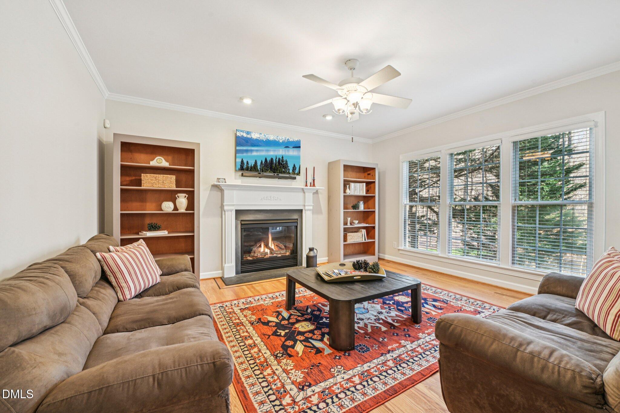 2013 Kinleys Way Raleigh, NC 27613 - Photo 23 of 68 a living room with furniture or couch and a fireplace