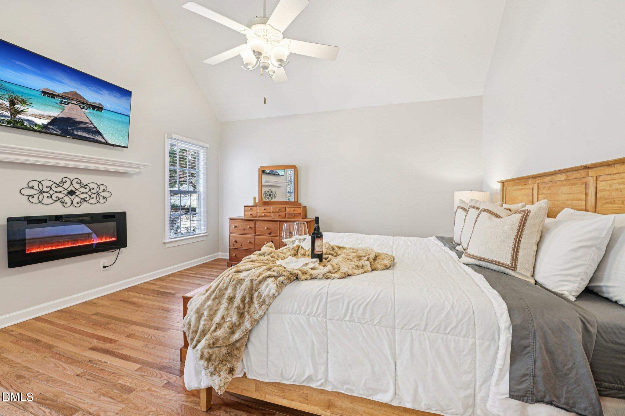 2013 Kinleys Way Raleigh, NC 27613 - Photo 28 of 68 a bedroom with a bed and a fireplace