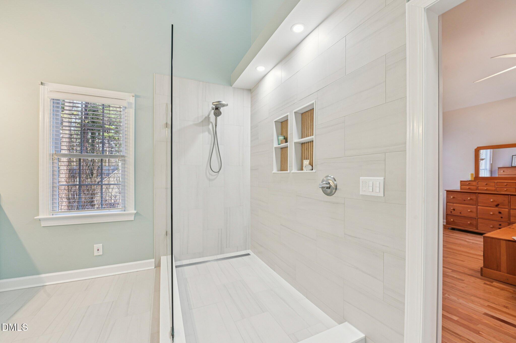 2013 Kinleys Way Raleigh, NC 27613 - Photo 31 of 68 a bathroom with a bathtub and a shower