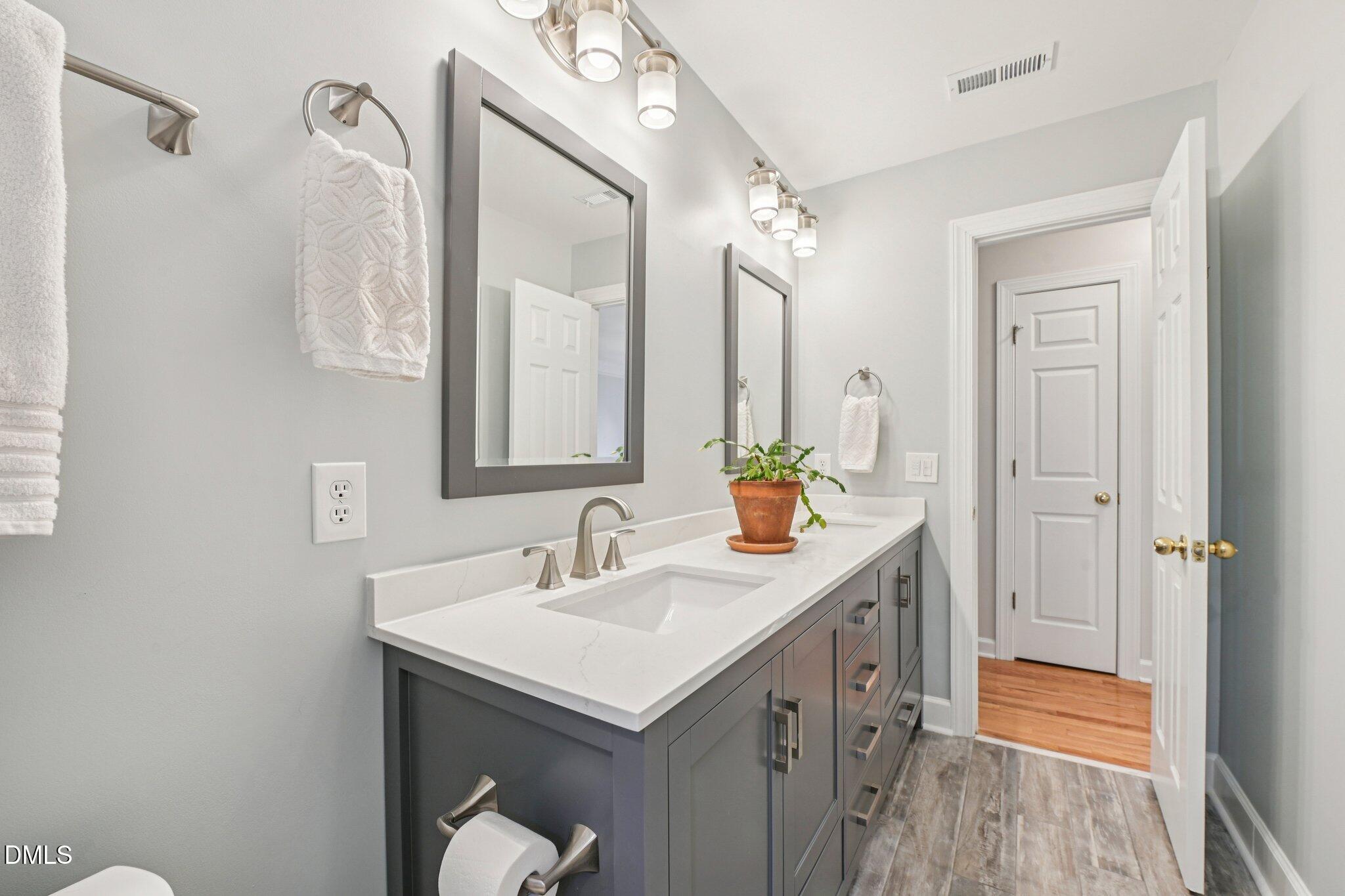 2013 Kinleys Way Raleigh, NC 27613 - Photo 42 of 68 a bathroom with a sink and a mirror