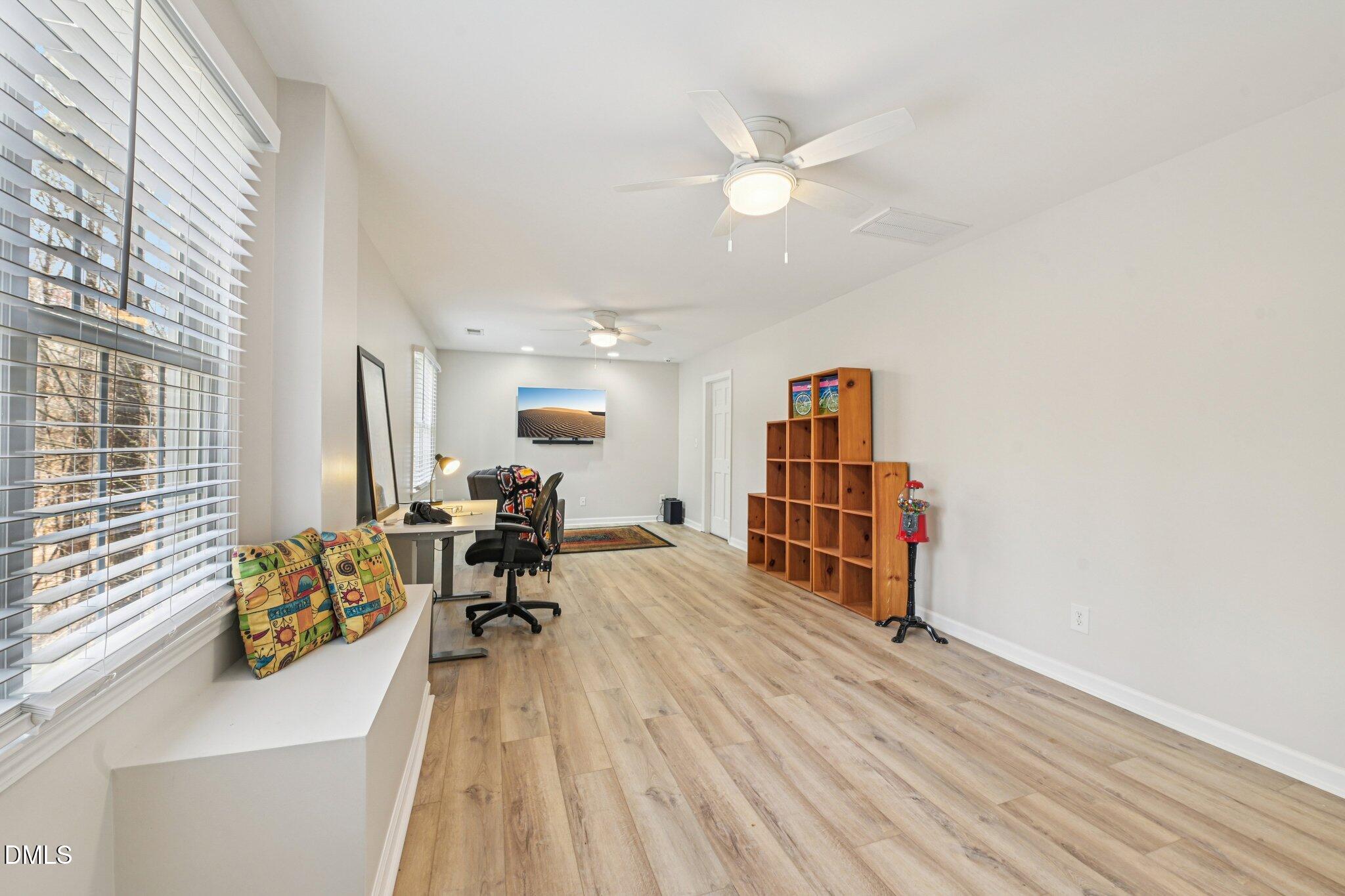 2013 Kinleys Way Raleigh, NC 27613 - Photo 44 of 68 a living room with furniture and a chandelier