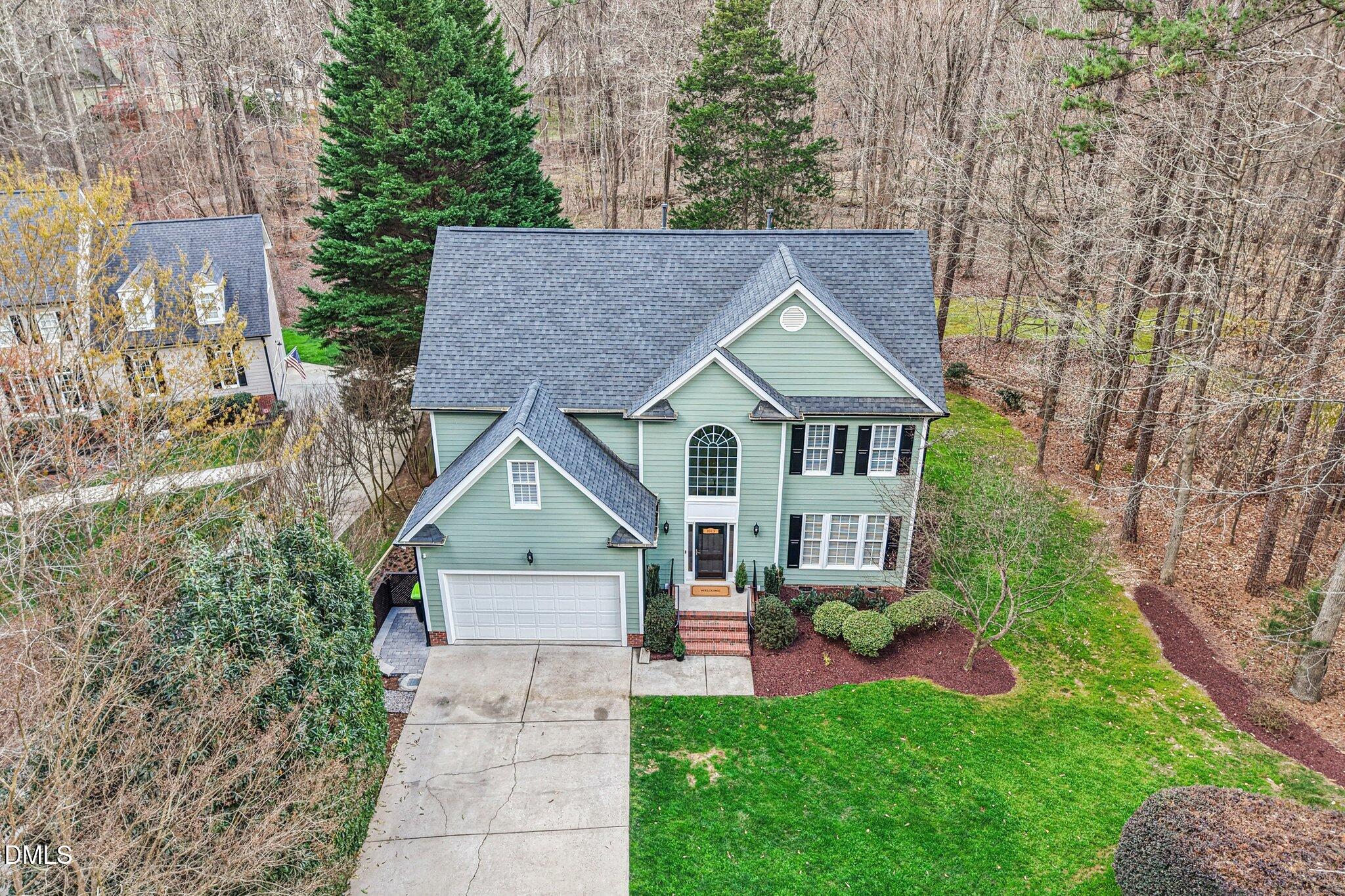 2013 Kinleys Way Raleigh, NC 27613 - Photo 59 of 68 a aerial view of a house next to a big yard and large trees