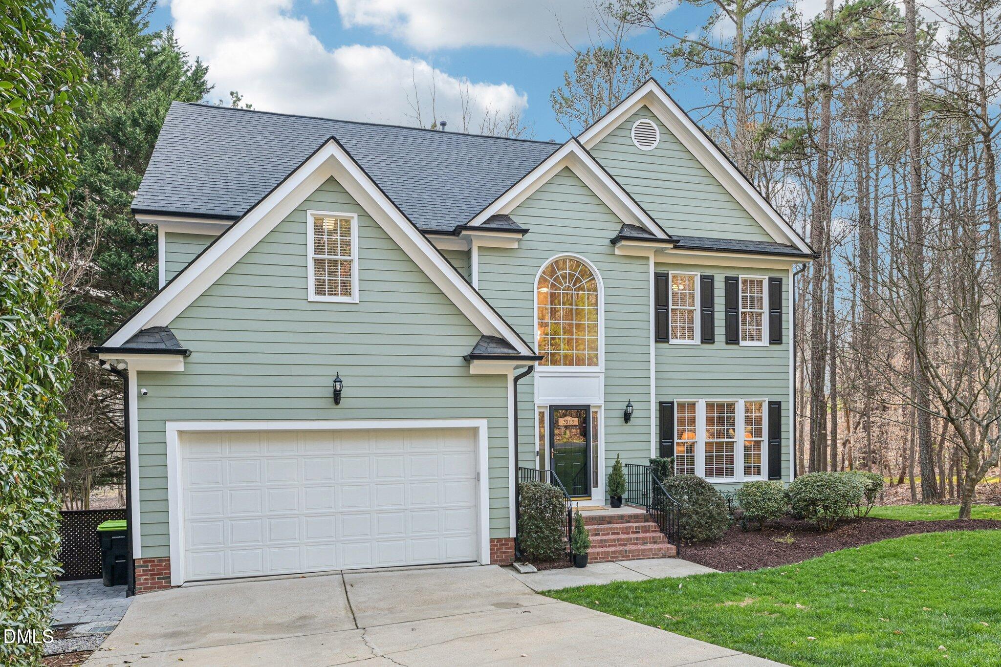 2013 Kinleys Way Raleigh, NC 27613 - Photo 6 of 68 a front view of a house with a garden