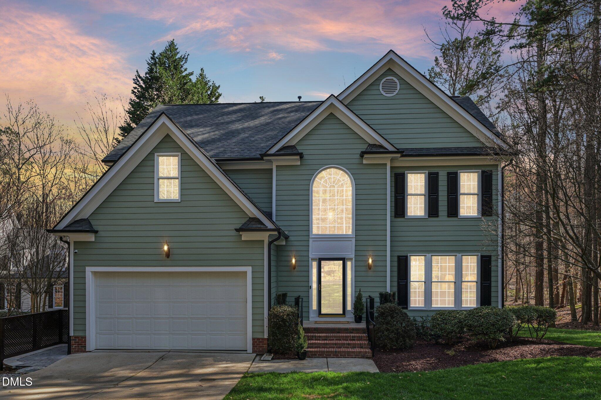 2013 Kinleys Way Raleigh, NC 27613 - Photo 62 of 68 a front view of a house with a yard