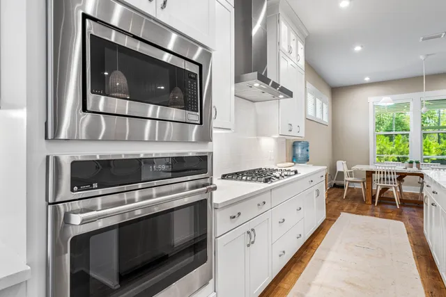 a kitchen with a stove and a microwave