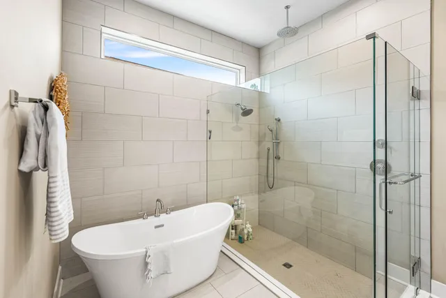a white bath tub sitting next to a white sink