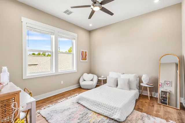 a bedroom with furniture and a window
