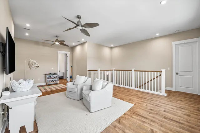 a living room with furniture fireplace and flat screen tv