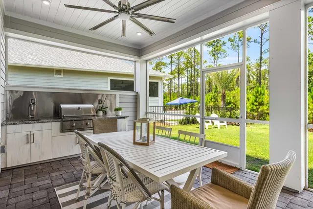 a front view of a house with a garden and porch