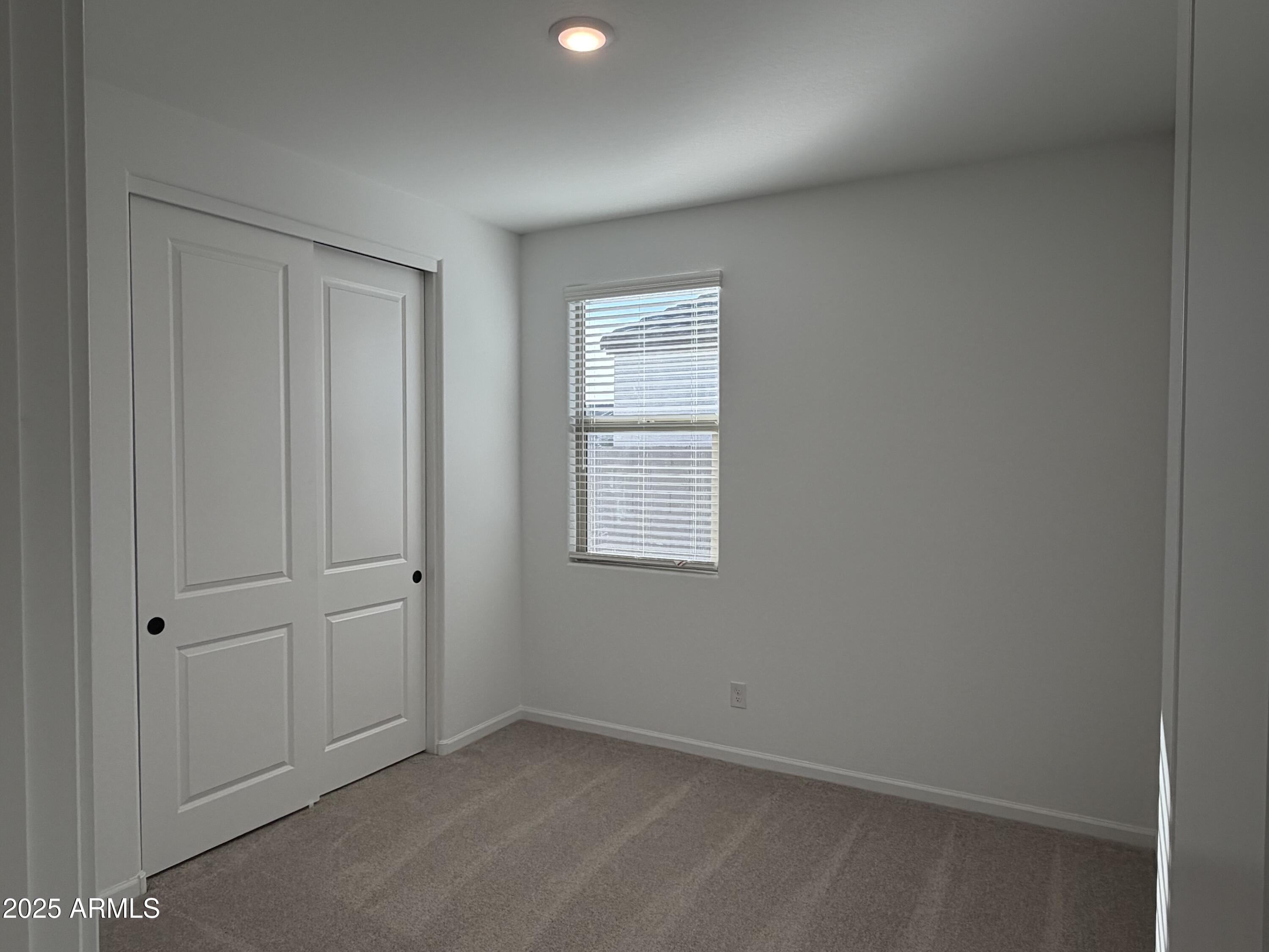 5533 West Buist Avenue Laveen, AZ 85339 - Photo 27 of 42 an empty room with windows