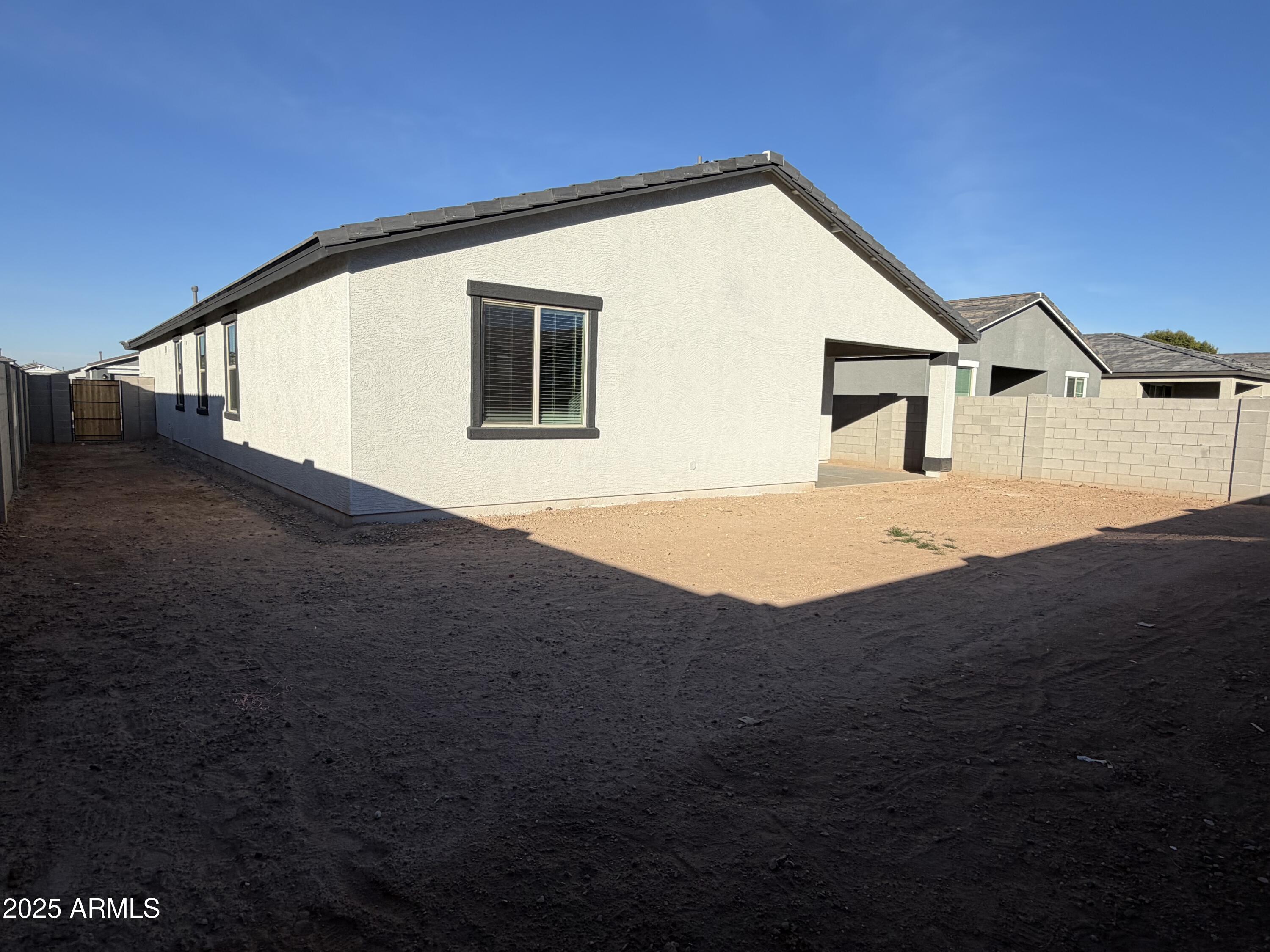 5533 West Buist Avenue Laveen, AZ 85339 - Photo 29 of 42 a front view of a house with a yard