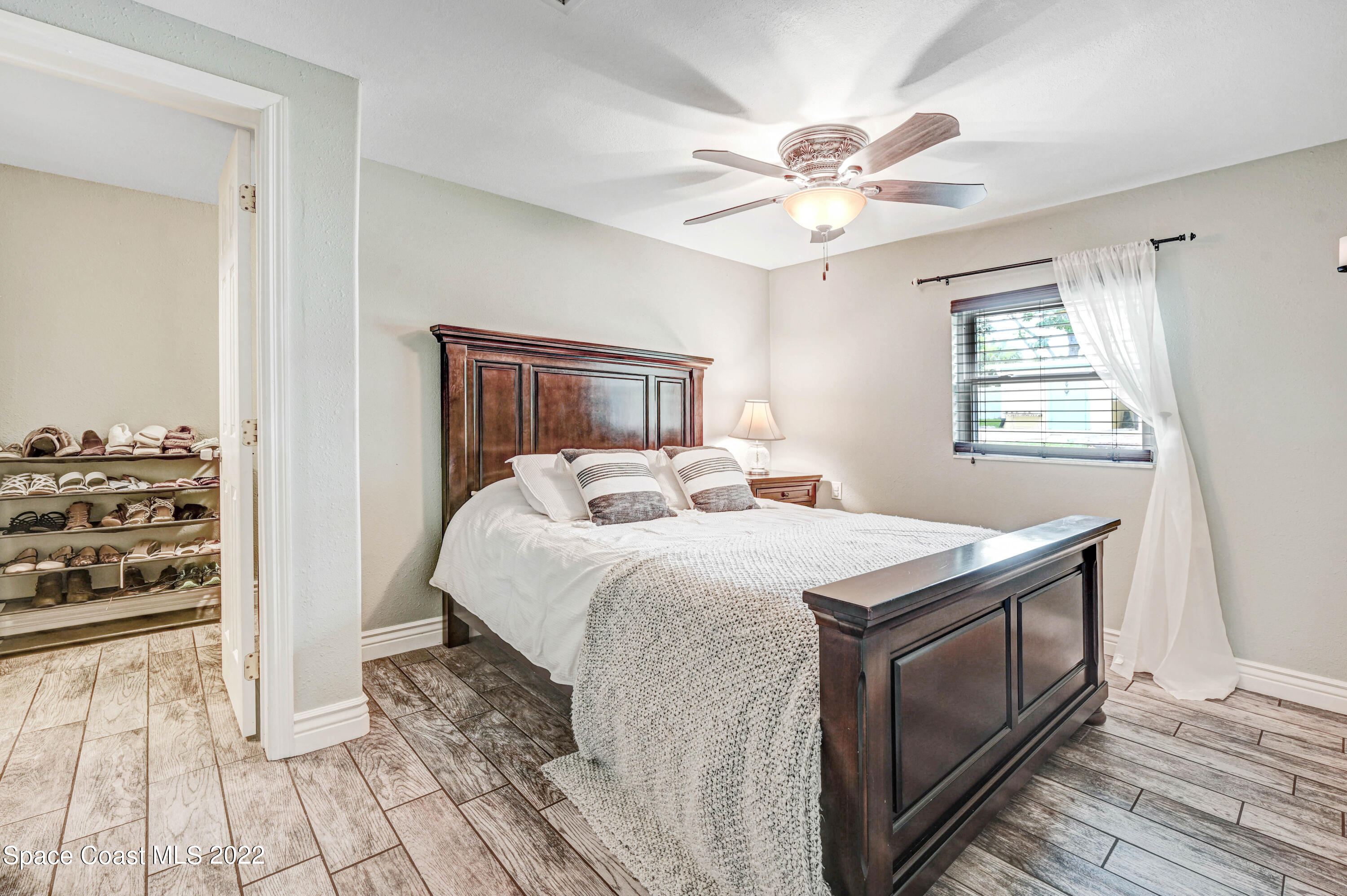 1304 Lichty Street Palm Bay, FL 32905 - Photo 17 of 57 a bedroom with a bed and a window
