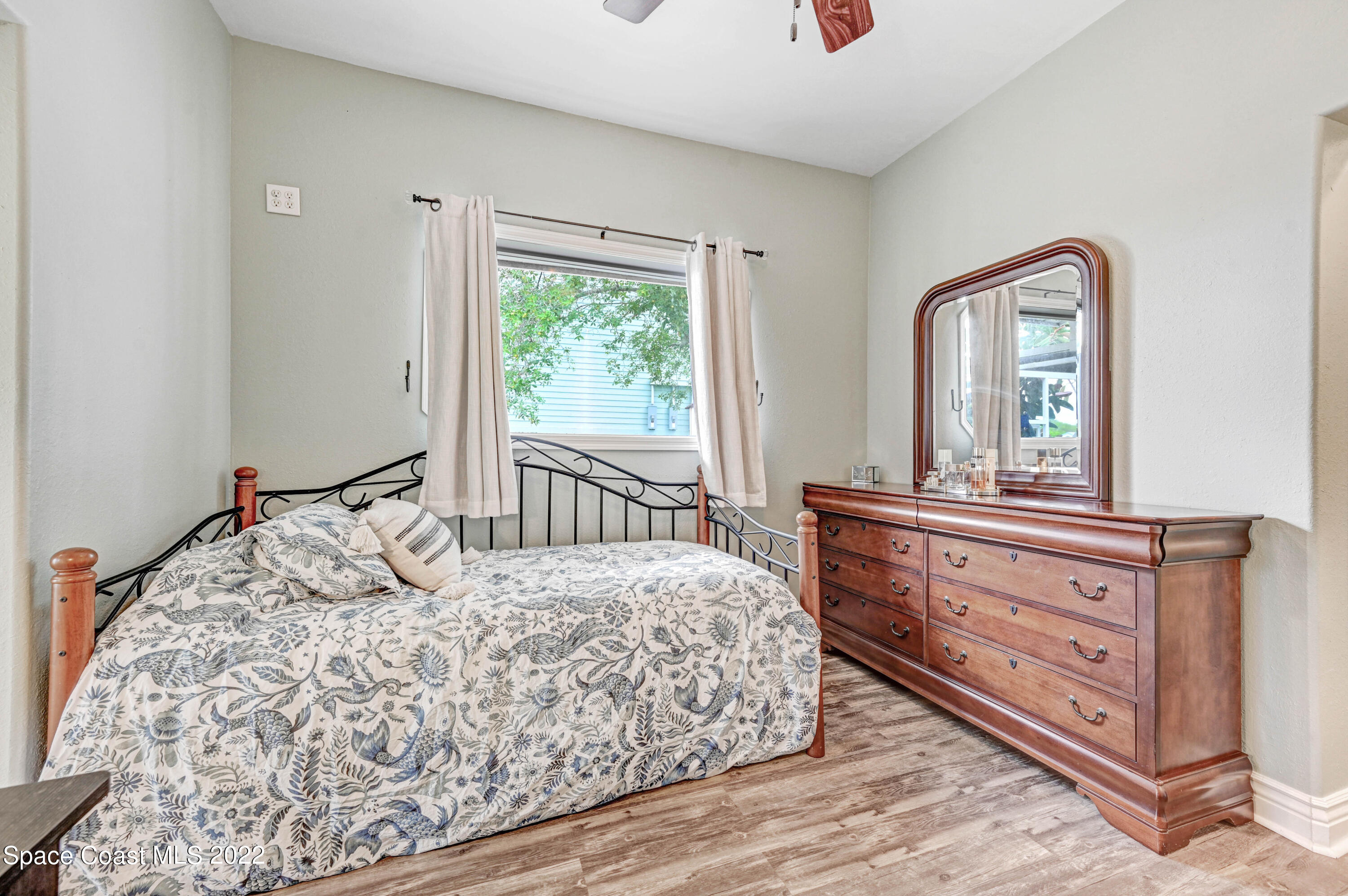 1304 Lichty Street Palm Bay, FL 32905 - Photo 22 of 57 a bedroom with a bed and a large window