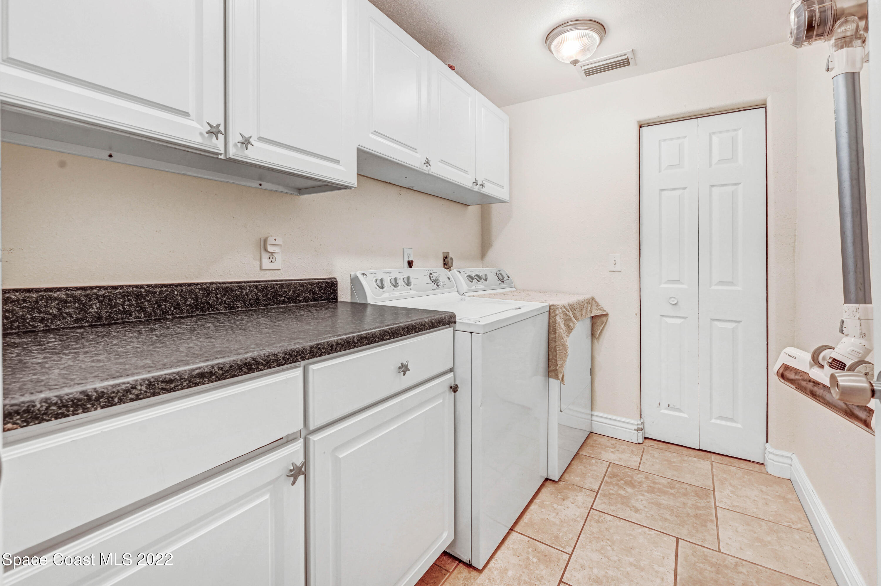 1304 Lichty Street Palm Bay, FL 32905 - Photo 28 of 57 a kitchen with a sink and cabinets