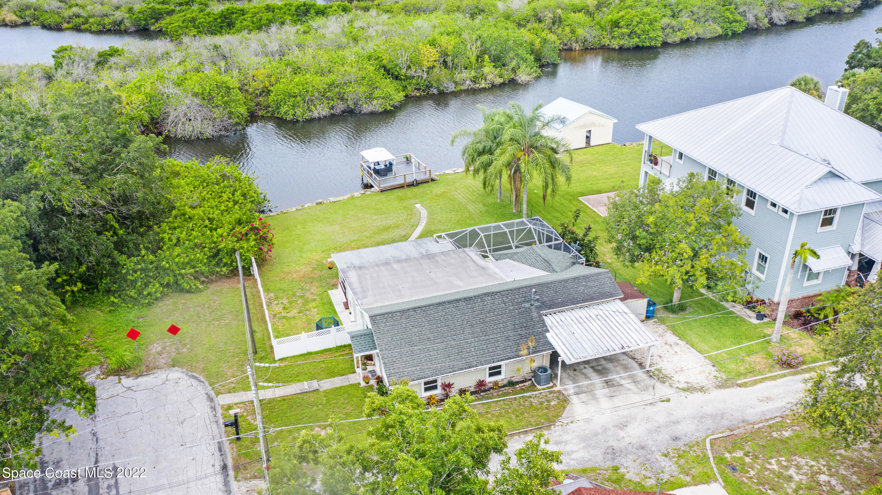 1304 Lichty Street Palm Bay, FL 32905 - Photo 45 of 57 an aerial view of a house with a lake view