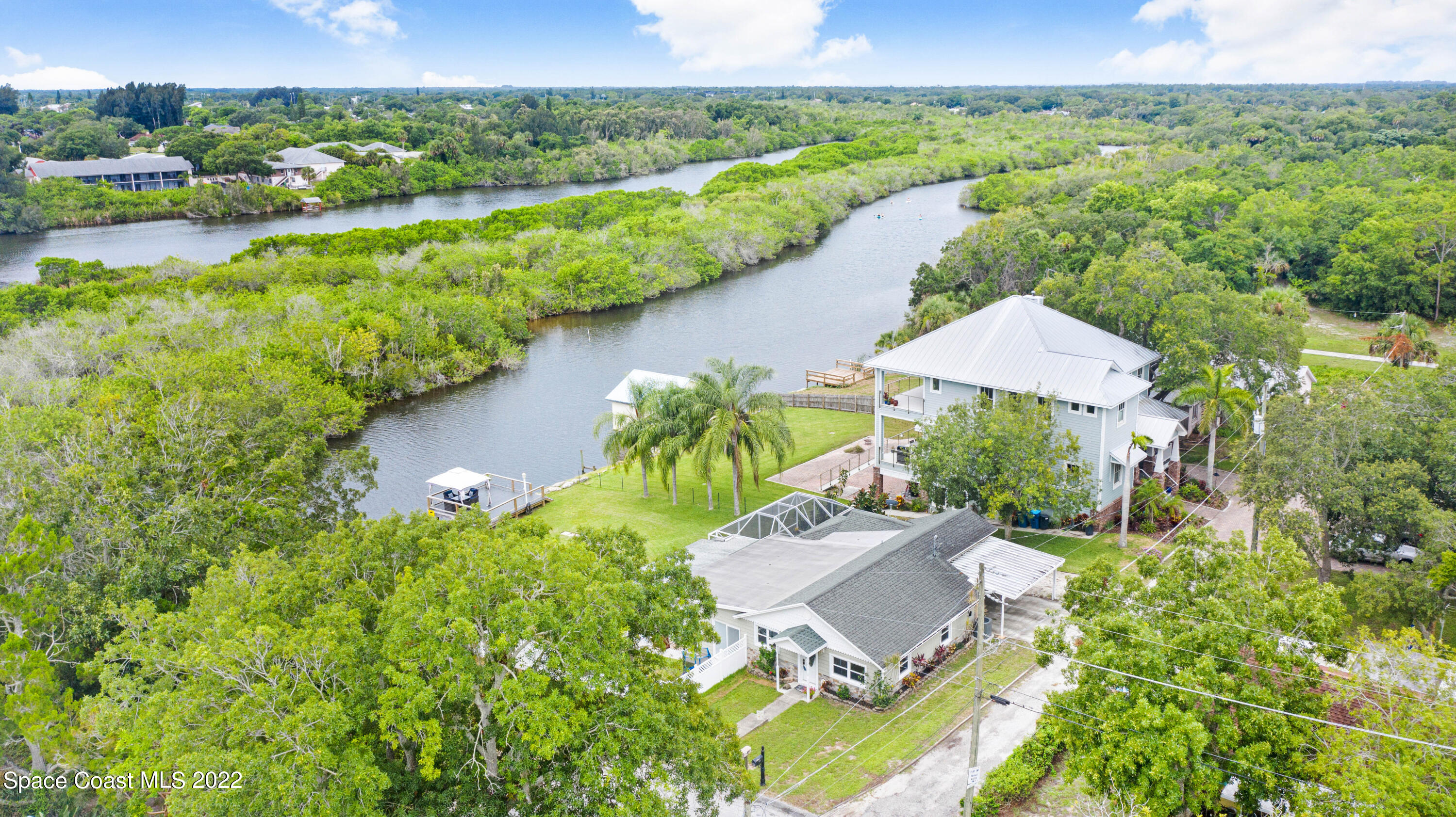 1304 Lichty Street Palm Bay, FL 32905 - Photo 46 of 57 an aerial view of a house with a garden