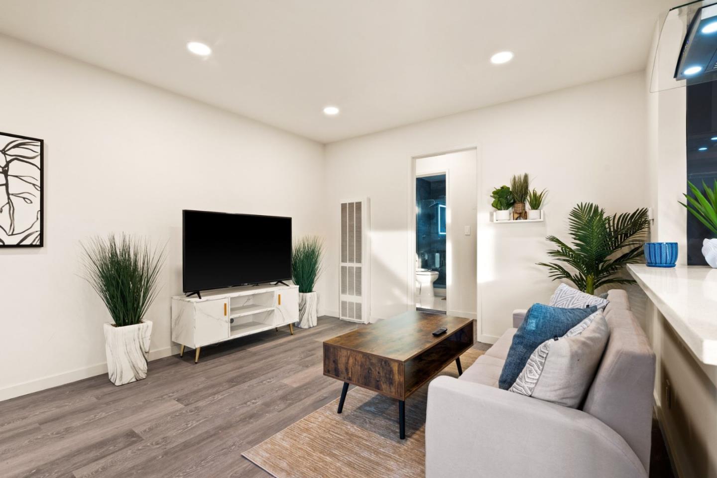 430 Dunster Drive Campbell, CA 95008 - Photo 11 of 31 a living room with furniture and a flat screen tv