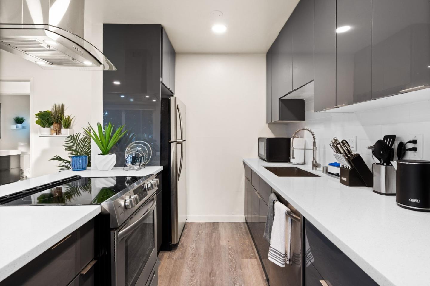 430 Dunster Drive Campbell, CA 95008 - Photo 15 of 31 a kitchen with a sink a counter and cabinets