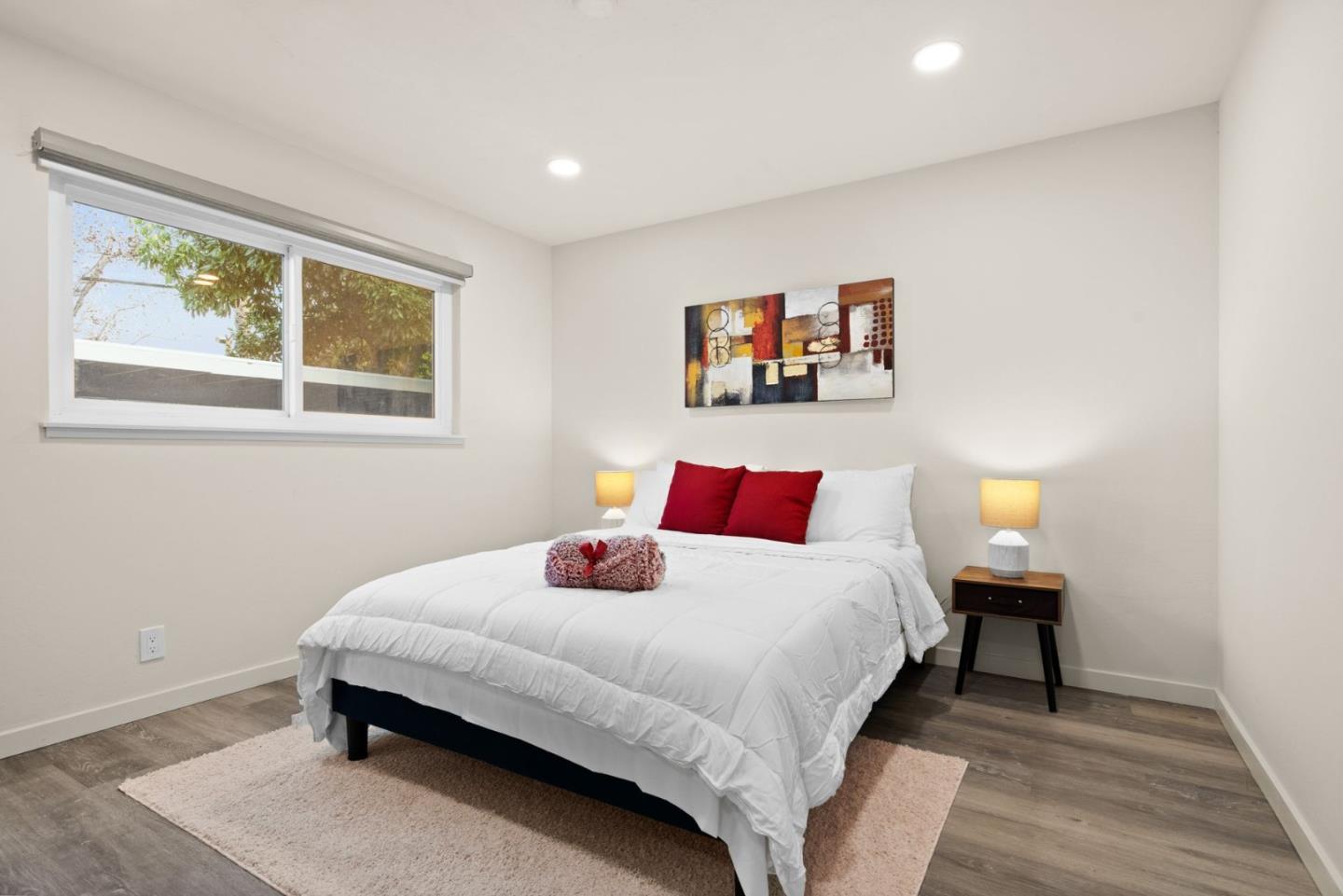 430 Dunster Drive Campbell, CA 95008 - Photo 17 of 31 a bedroom with a bed and a painting on the wall