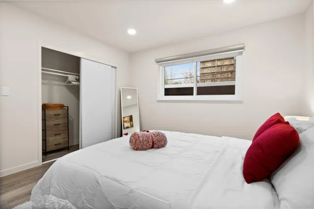 a bedroom with a bed and a closet