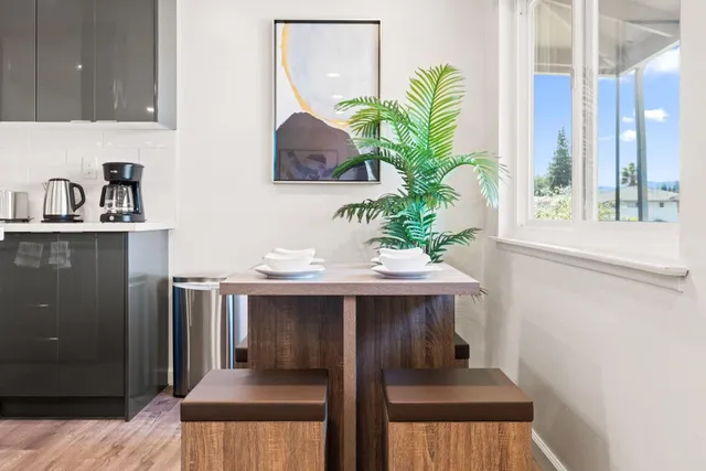 a view of kitchen with kitchen island a sink appliances and cabinets