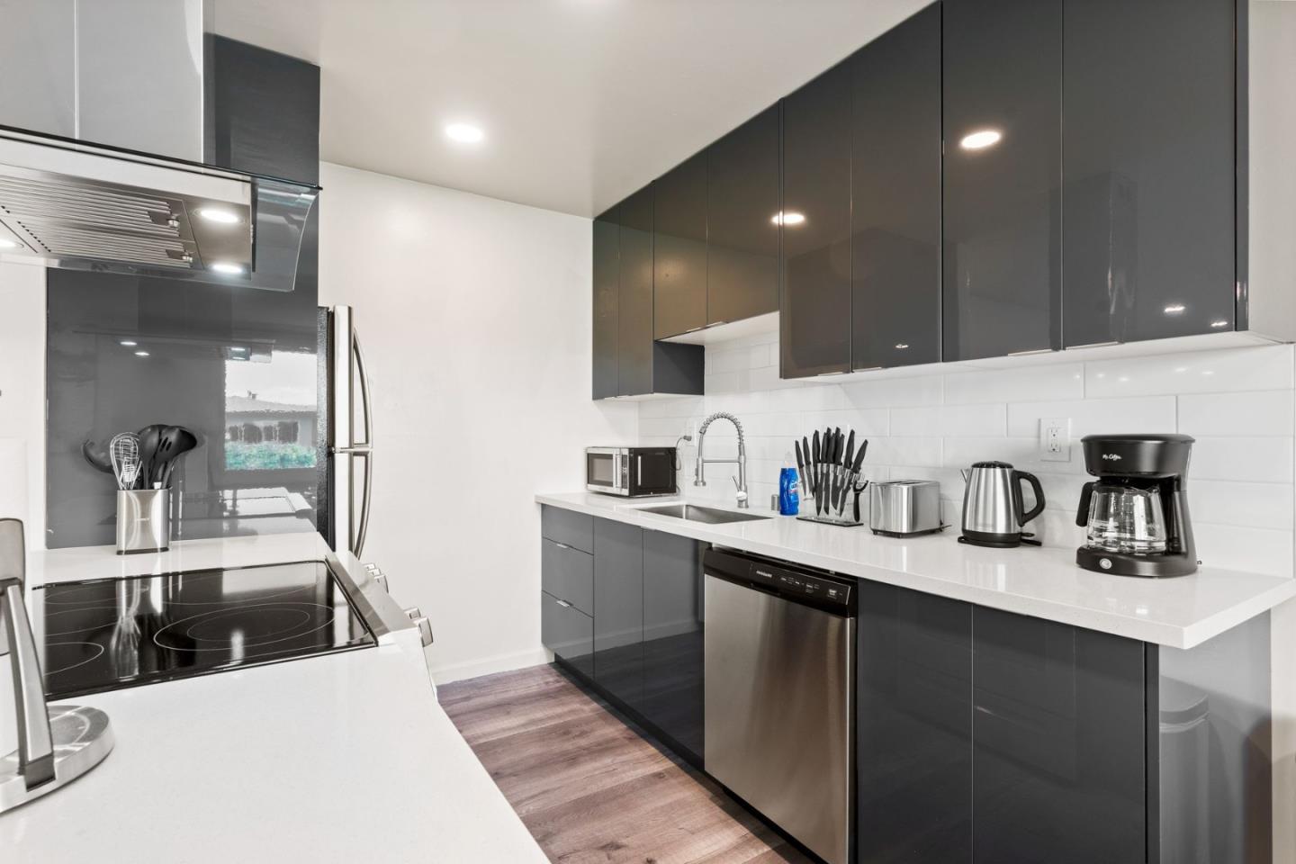 430 Dunster Drive Campbell, CA 95008 - Photo 26 of 31 a kitchen with stainless steel appliances granite countertop a sink a stove and cabinets