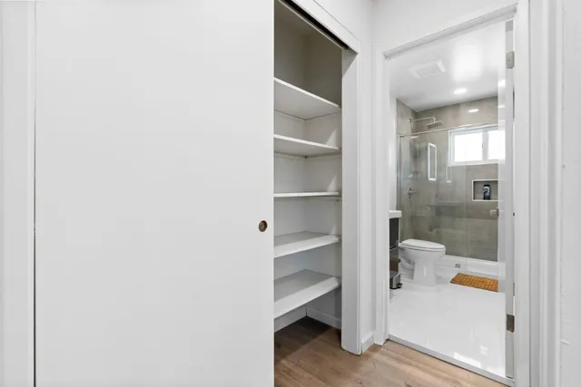 a bathroom with a glass shower door
