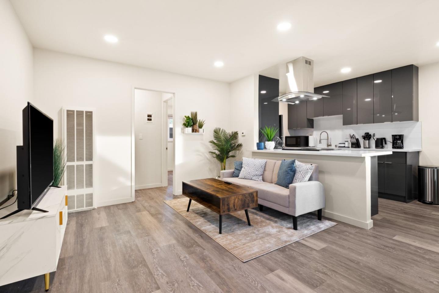 430 Dunster Drive Campbell, CA 95008 - Photo 7 of 31 a living room with furniture and a flat screen tv