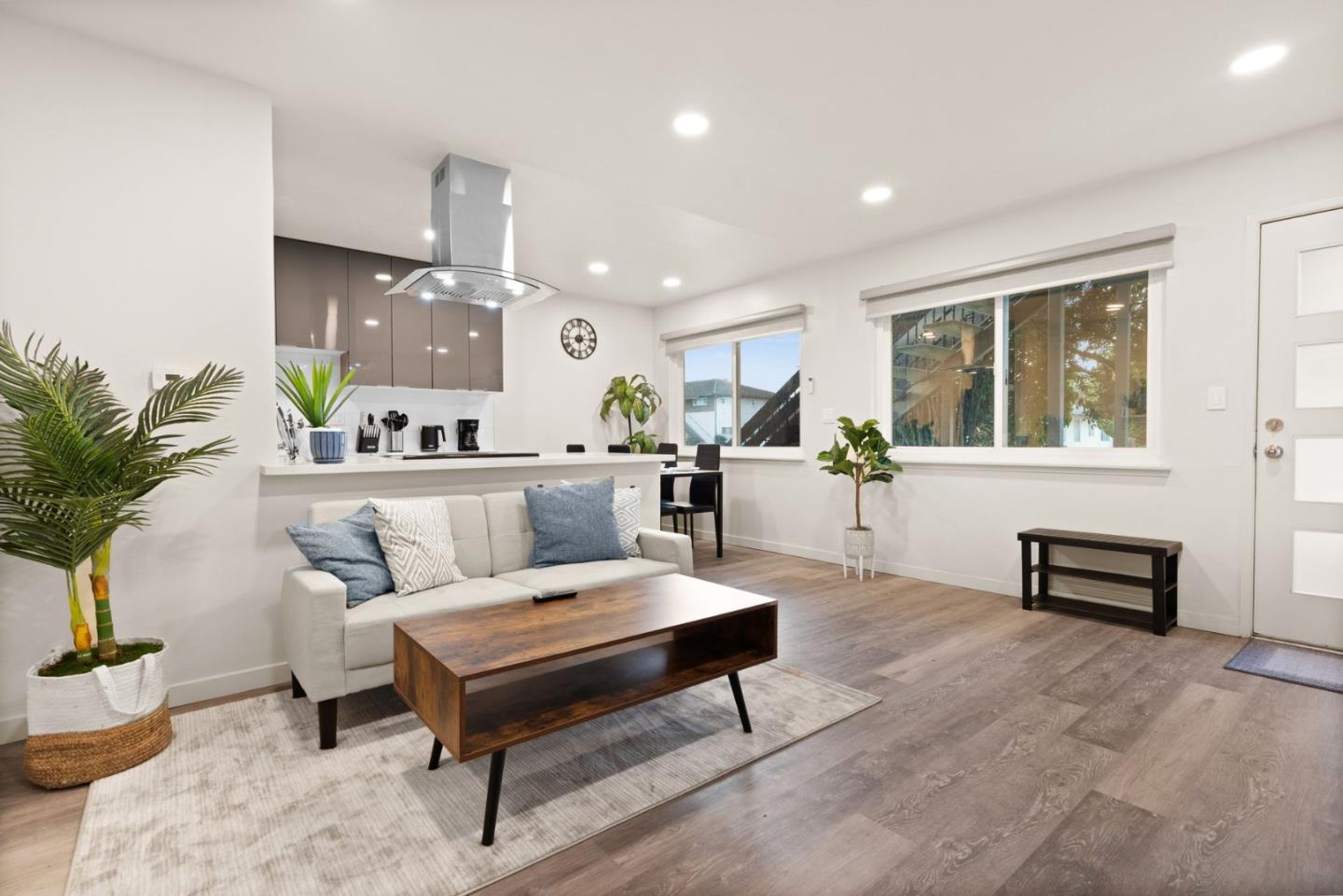 430 Dunster Drive Campbell, CA 95008 - Photo 8 of 31 a living room with furniture a rug and a potted plant