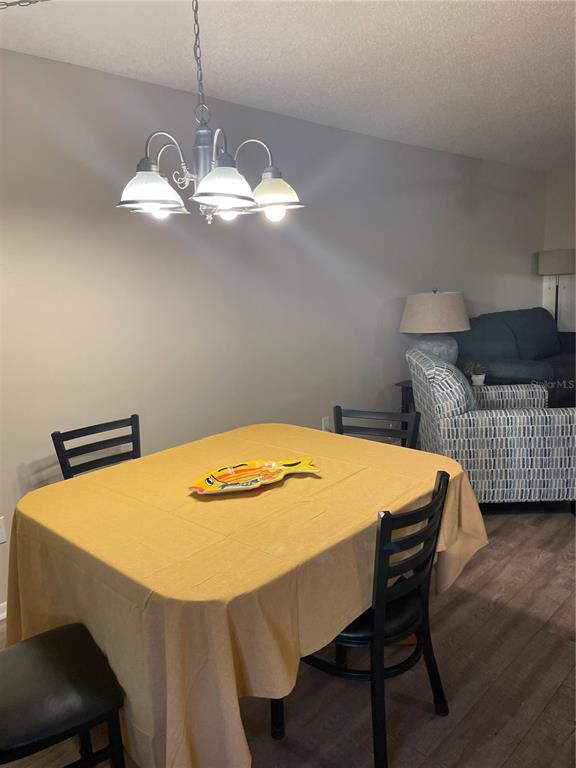 14531 Walsingham Road, Unit 203 Largo, FL 33774 - Photo 5 of 24 a dining room with a table and chairs