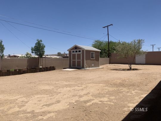 1320 Mayo Street Ridgecrest, CA 93555 - Photo 35 of 45 a swimming pool with a yard