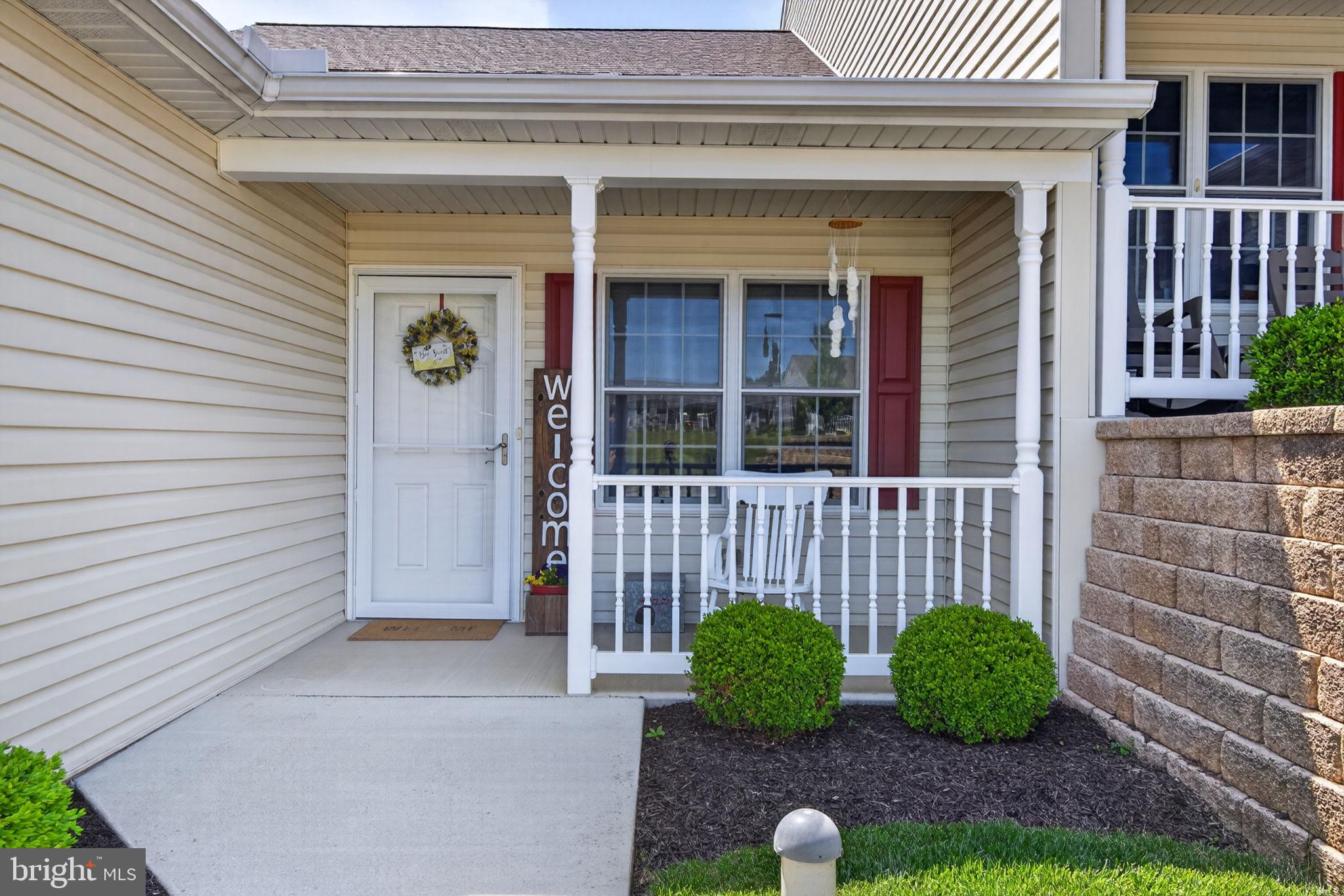 1332 Pleasant View Drive, Unit 75 Spring Grove, PA 17362 - Photo 3 of 26 a view of brick house with potted plants