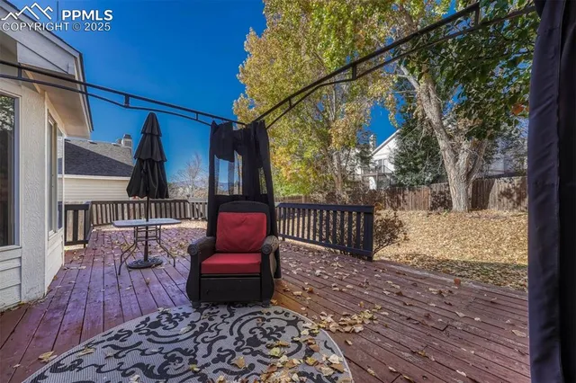 a view of balcony with wooden floor and outdoor seating