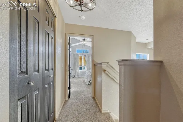 a view of a kitchen from the hallway