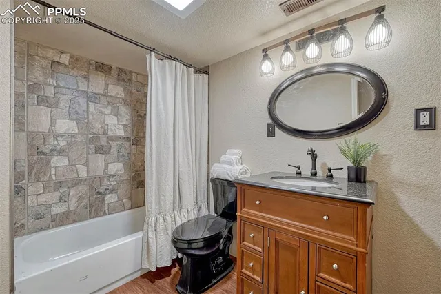 a aerial view of a house with a yard