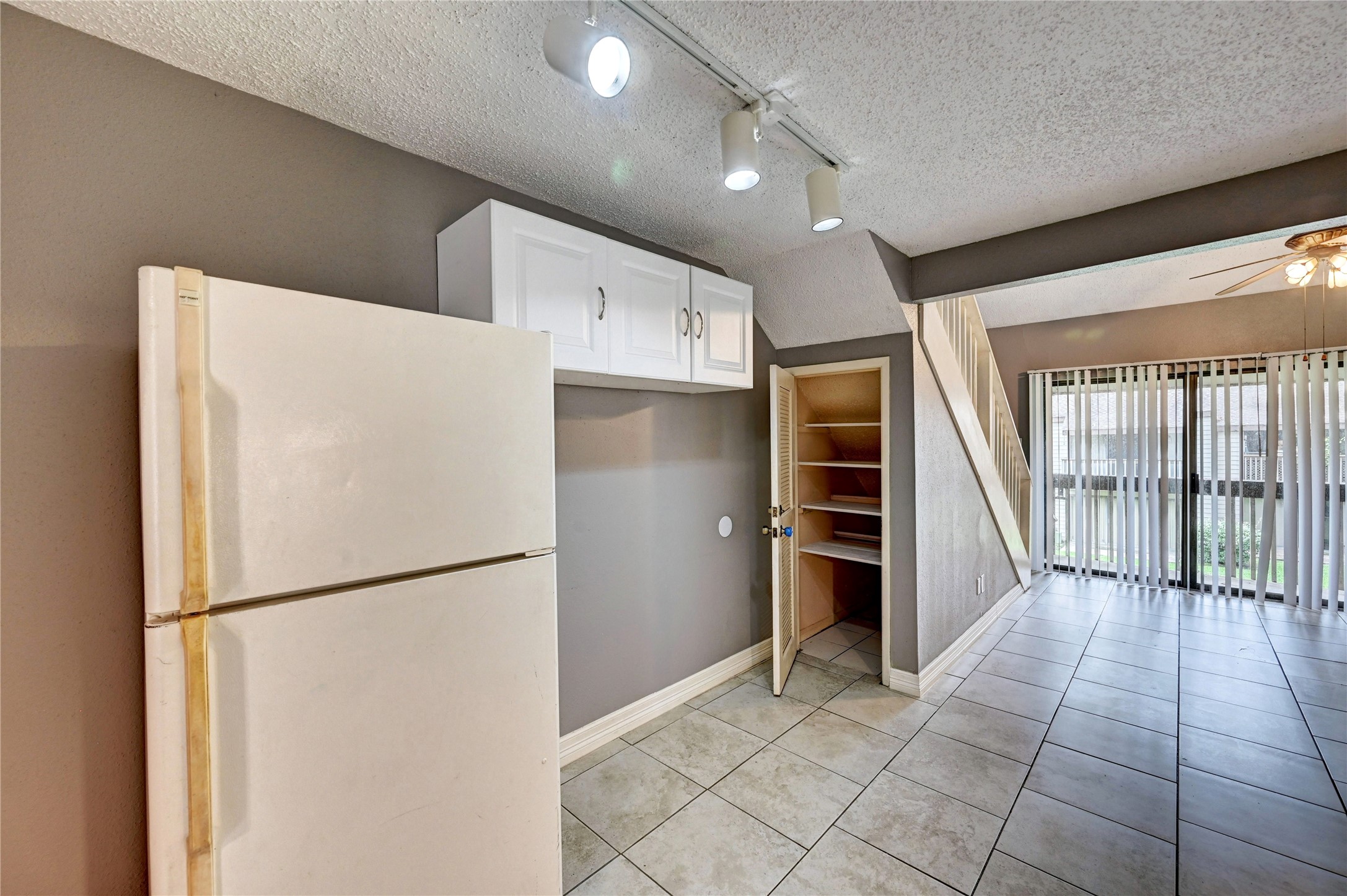 12900 Walden Road, Unit 6 Montgomery, TX 77356 - Photo 6 of 39 Refrigerator Included, and a spacious pantry in the kitchen area.