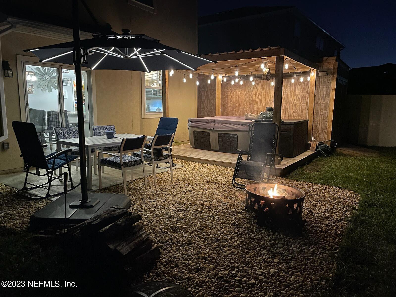 3822 Bronco Road Middleburg, FL 32068 - Photo 27 of 37 a view of a chairs and table in backyard