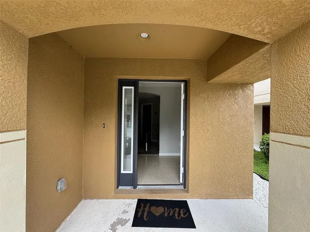 a view of a door and a window