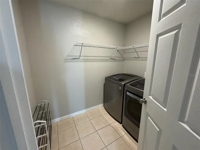 a view of a storage and utility room with racks on the wall