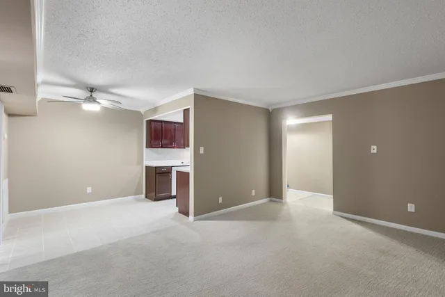 a bedroom with bed and a potted plant