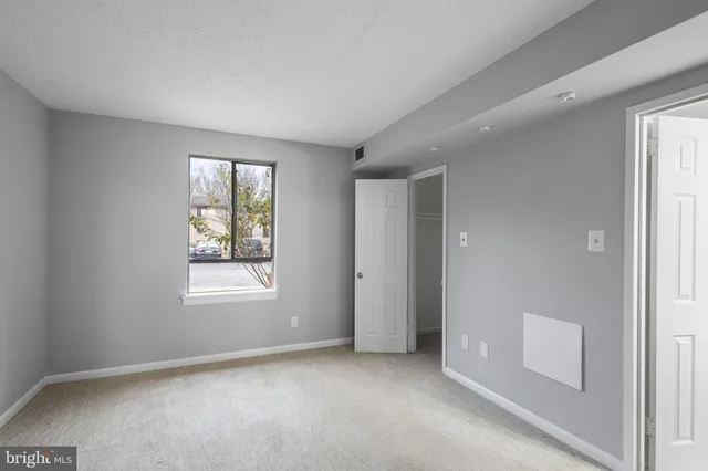 a bedroom with bed and tv