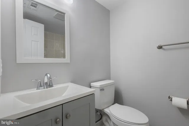 a view of a hallway with a white walls