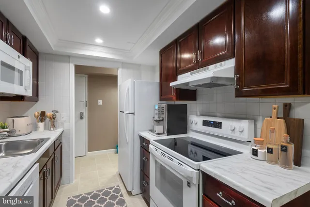 a kitchen with a stove and a sink