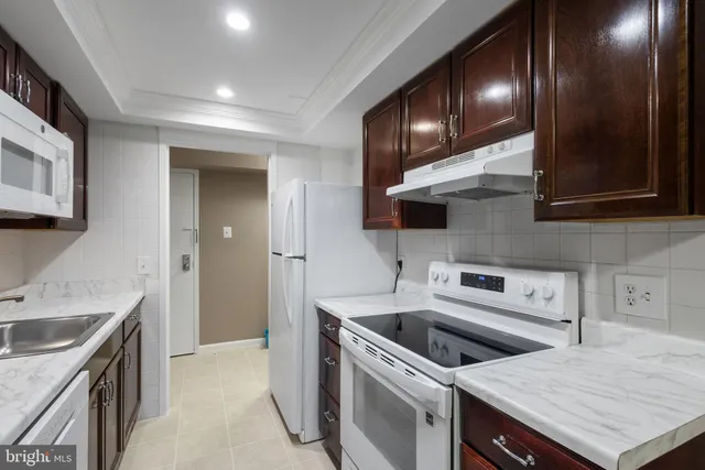 a kitchen with a stove and a sink