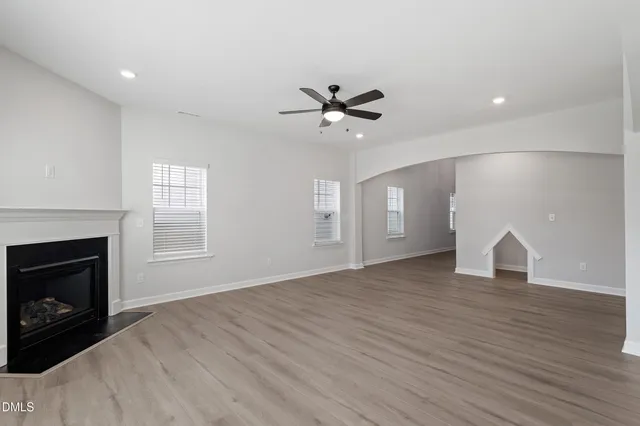 a kitchen with kitchen island granite countertop a stove cabinets and refrigerator