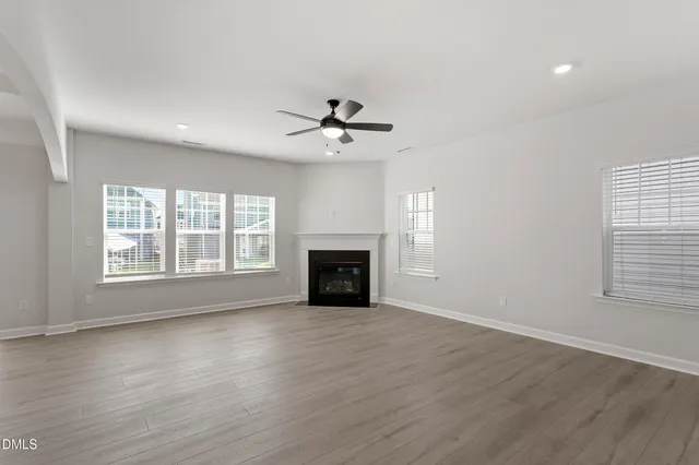 a kitchen with a stove cabinets and microwave