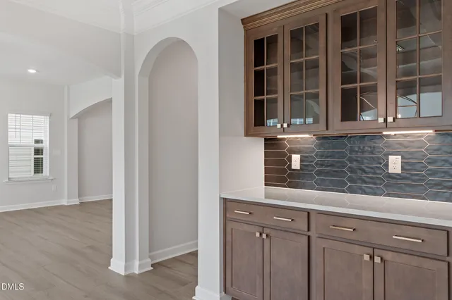 a view of cabinets and wooden floor