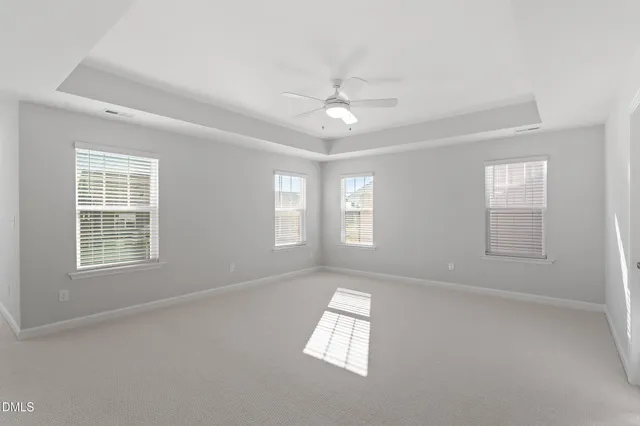 a bathroom with a tub a sink and mirror